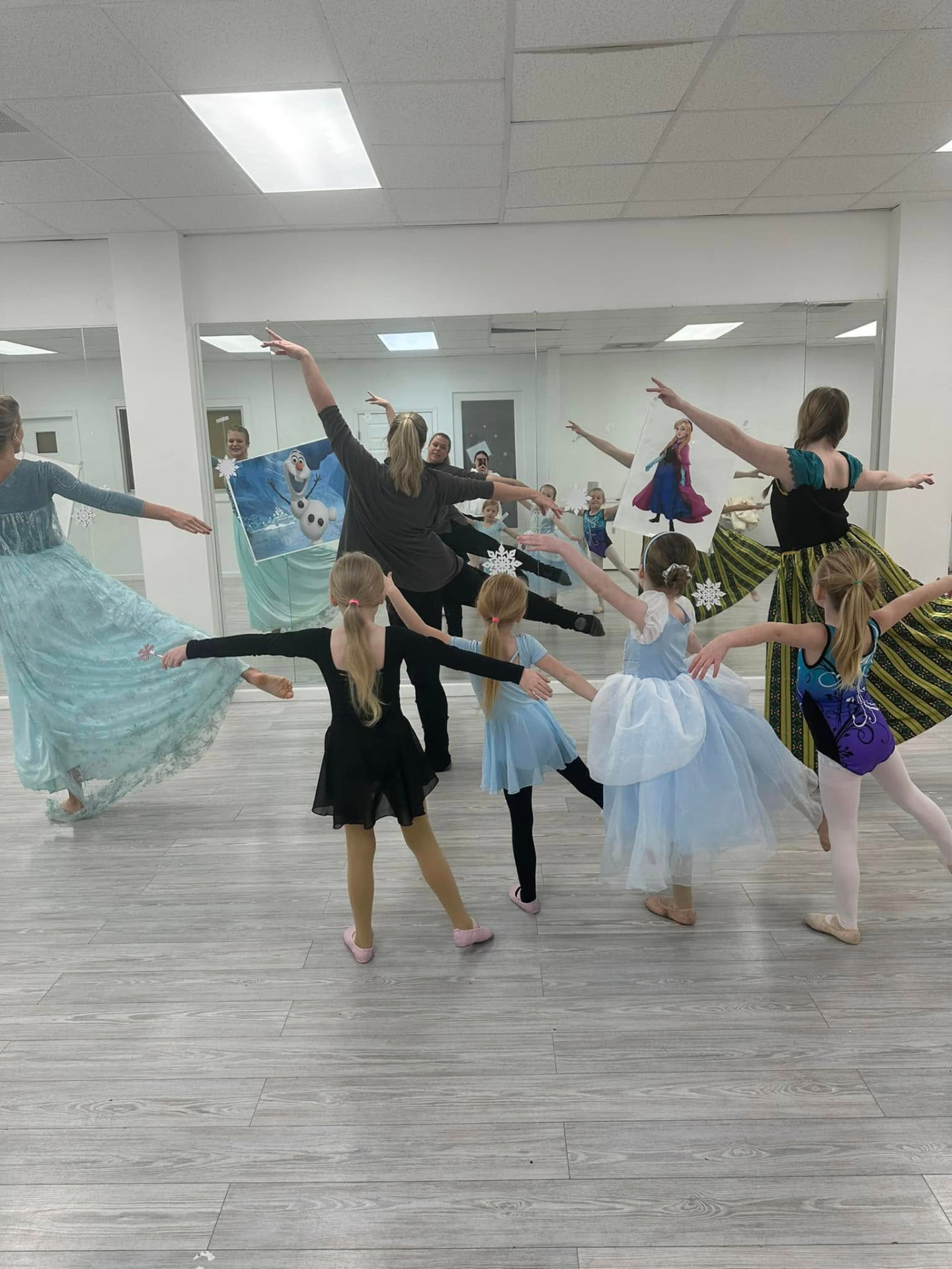 Preschool dancers in princess costumes practicing together in the studio